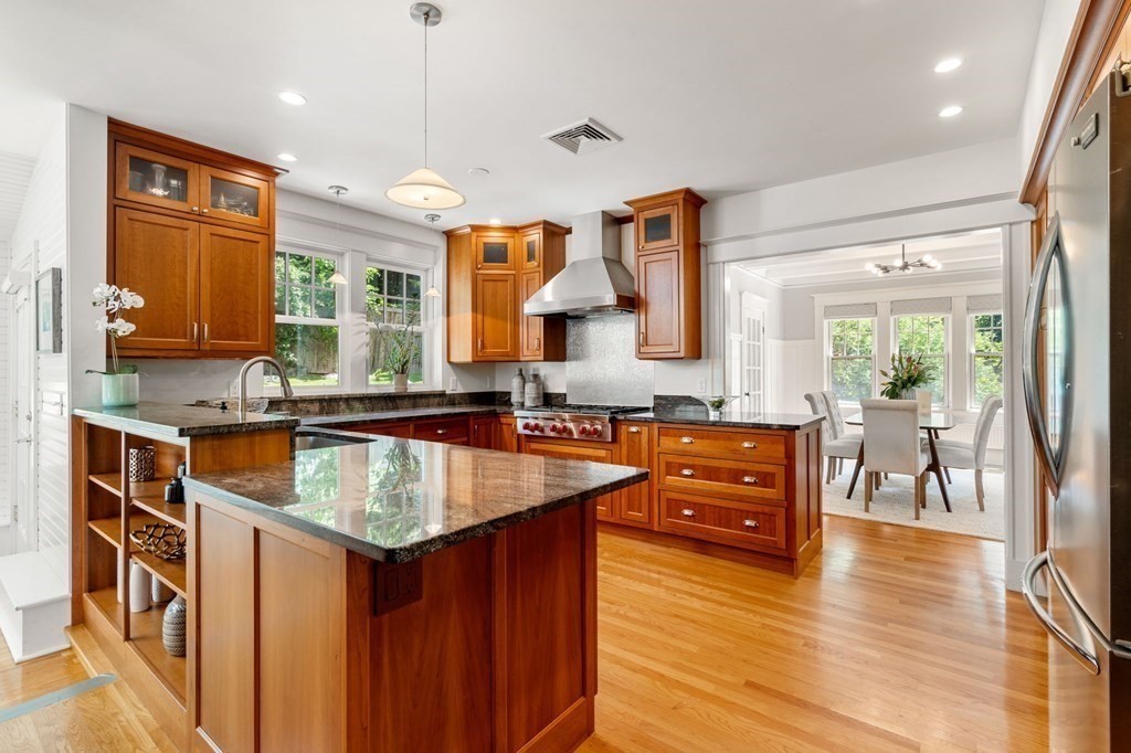 25 Windsor Road Brookline, MA 02445 - Photo 8 of 31 a kitchen with stainless steel appliances granite countertop wooden cabinets sink and stove