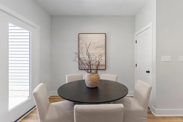 a dining room with furniture and window