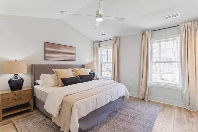 a bedroom with bed and window