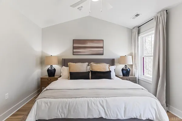 a bed room with a bed and a night stand