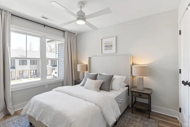 a bedroom with a large bed and a window