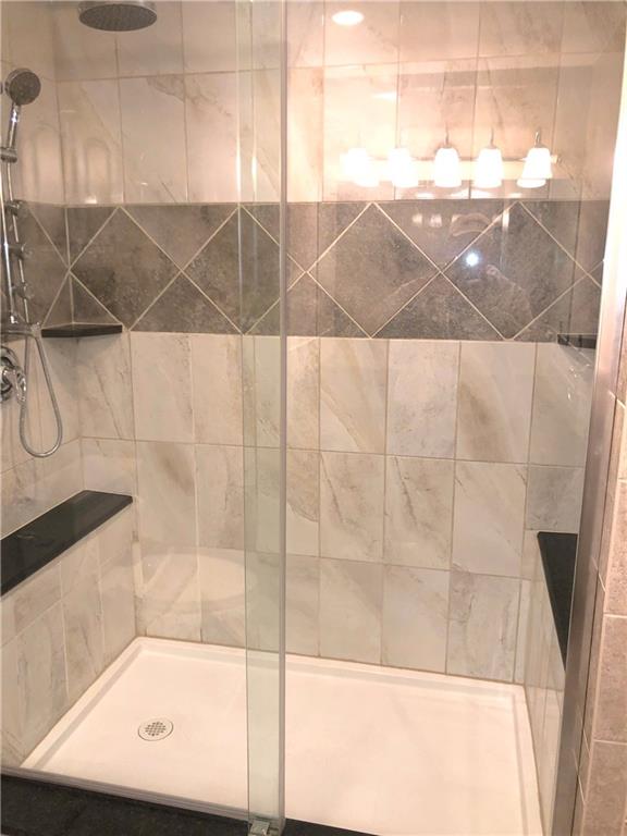 211 Adams Pointe Boulevard, Unit 10 Mars, PA 16046 - Photo 16 of 33 a bathroom with a shower