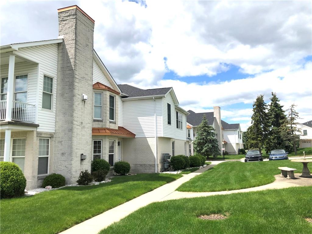 211 Adams Pointe Boulevard, Unit 10 Mars, PA 16046 - Photo 23 of 33 a front view of a house with a yard