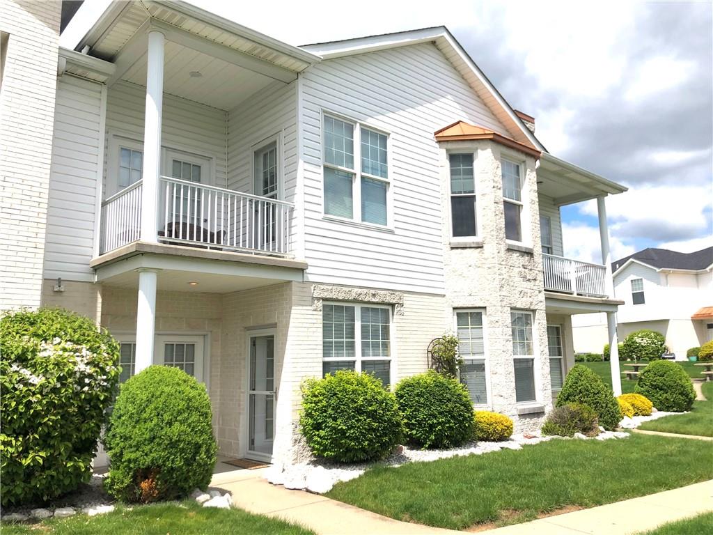 211 Adams Pointe Boulevard, Unit 10 Mars, PA 16046 - Photo 25 of 33 front view of a house with a yard