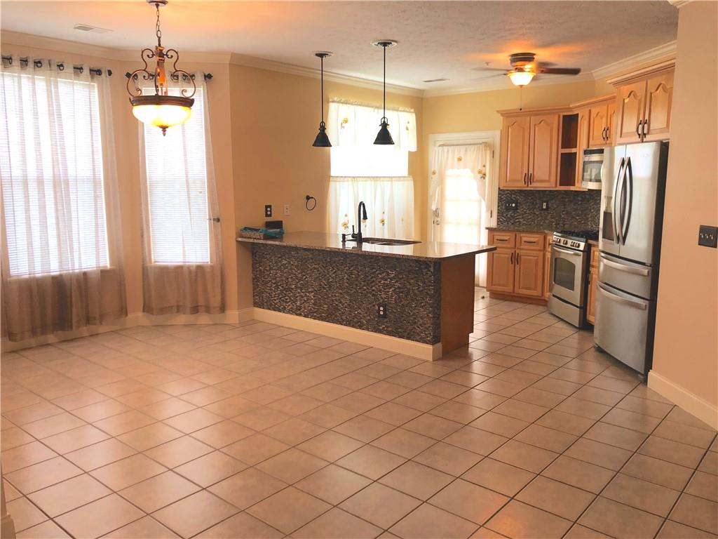 211 Adams Pointe Boulevard, Unit 10 Mars, PA 16046 - Photo 6 of 33 a kitchen with stainless steel appliances granite countertop a refrigerator and a sink