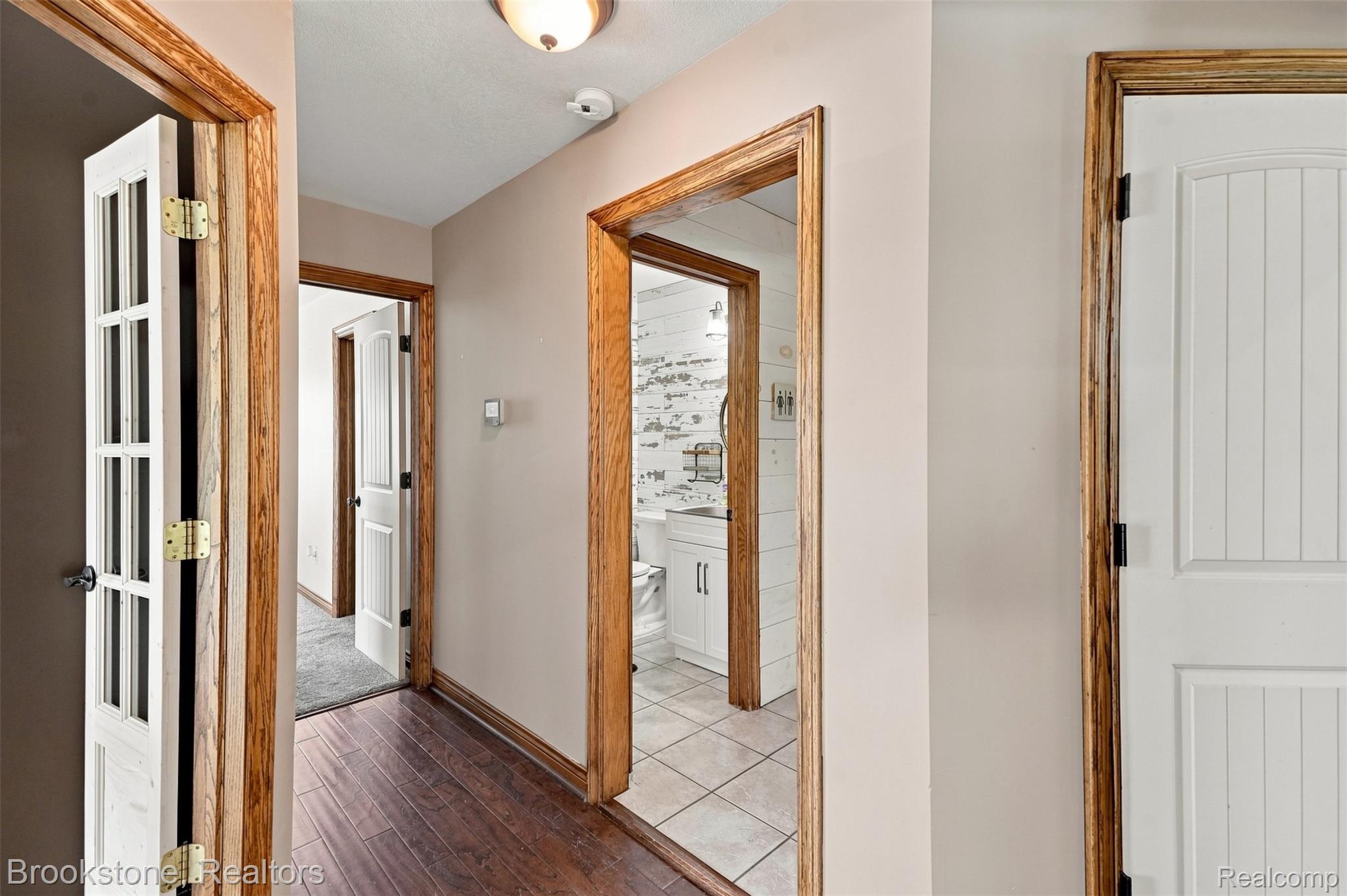 1775 Dutcher Road Howell, MI 48843 - Photo 13 of 41 Wood-finish flooring throughout the hallway