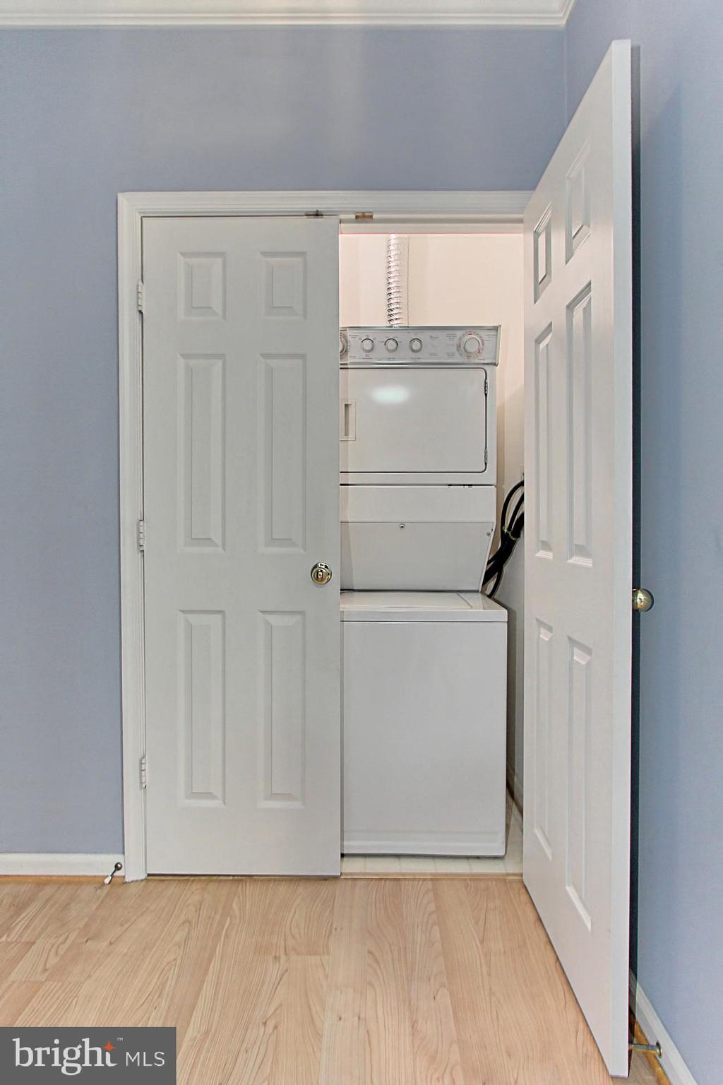 1708 Lake Shore Crest Drive, Unit 24 Reston, VA 20190 - Photo 21 of 29 Stacked Washer/Dryer is Tucked Away