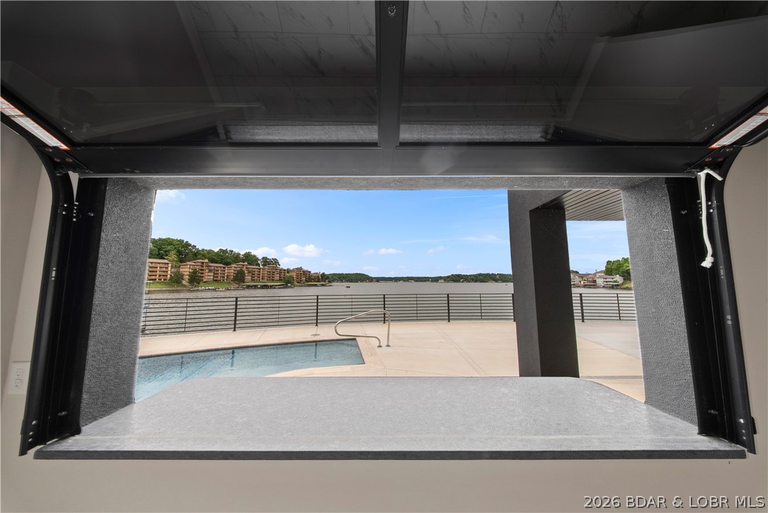 439 Red Bud Road Lake Ozark, MO 65049 - Photo 5 of 98 Covered lakeside patio with seamless indoor-outdoo