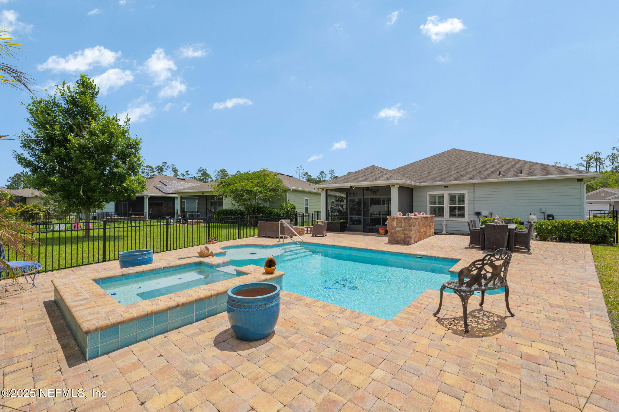 124 Tintamarre Drive St. Augustine, FL 32092 - Photo 19 of 40 a view of a patio with a table and chairs