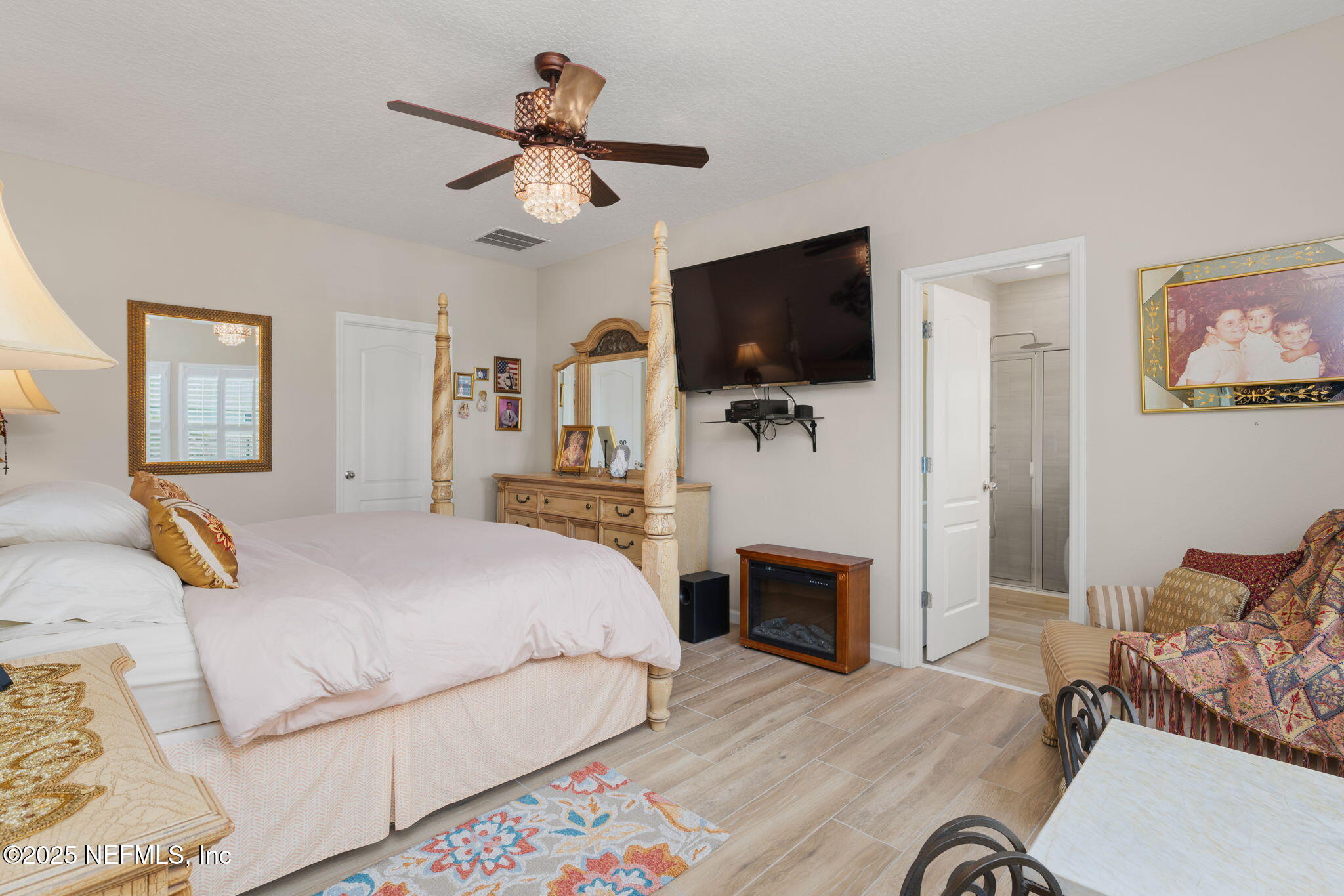 124 Tintamarre Drive St. Augustine, FL 32092 - Photo 24 of 40 a bedroom with a bed and a flat screen tv