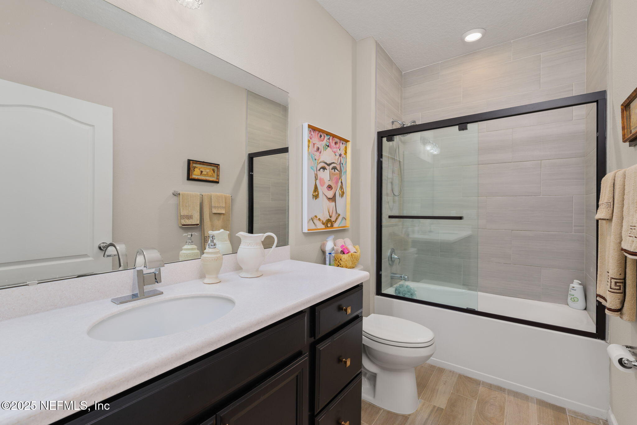 124 Tintamarre Drive St. Augustine, FL 32092 - Photo 31 of 40 a bathroom with a double vanity sink toilet mirror and shower