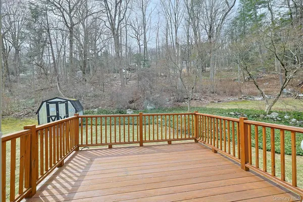 a view of a balcony with wooden floor