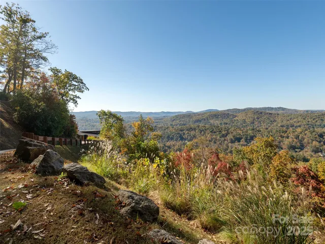 a view of a town with mountains in the background