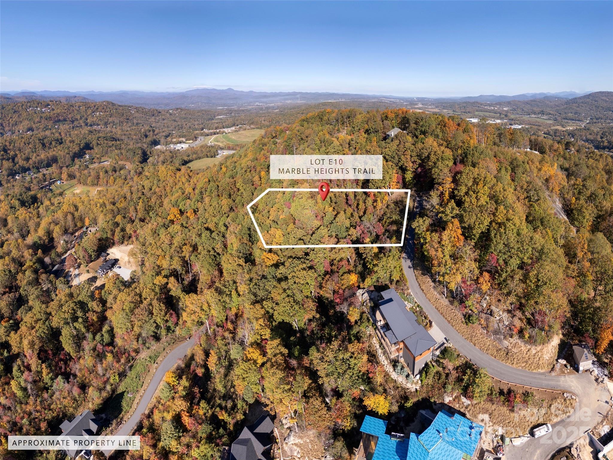 Lot E10 Marble Heights Trail, Unit NONE Hendersonville, NC 28791 - Photo 4 of 16 an aerial view of residential building with parking space