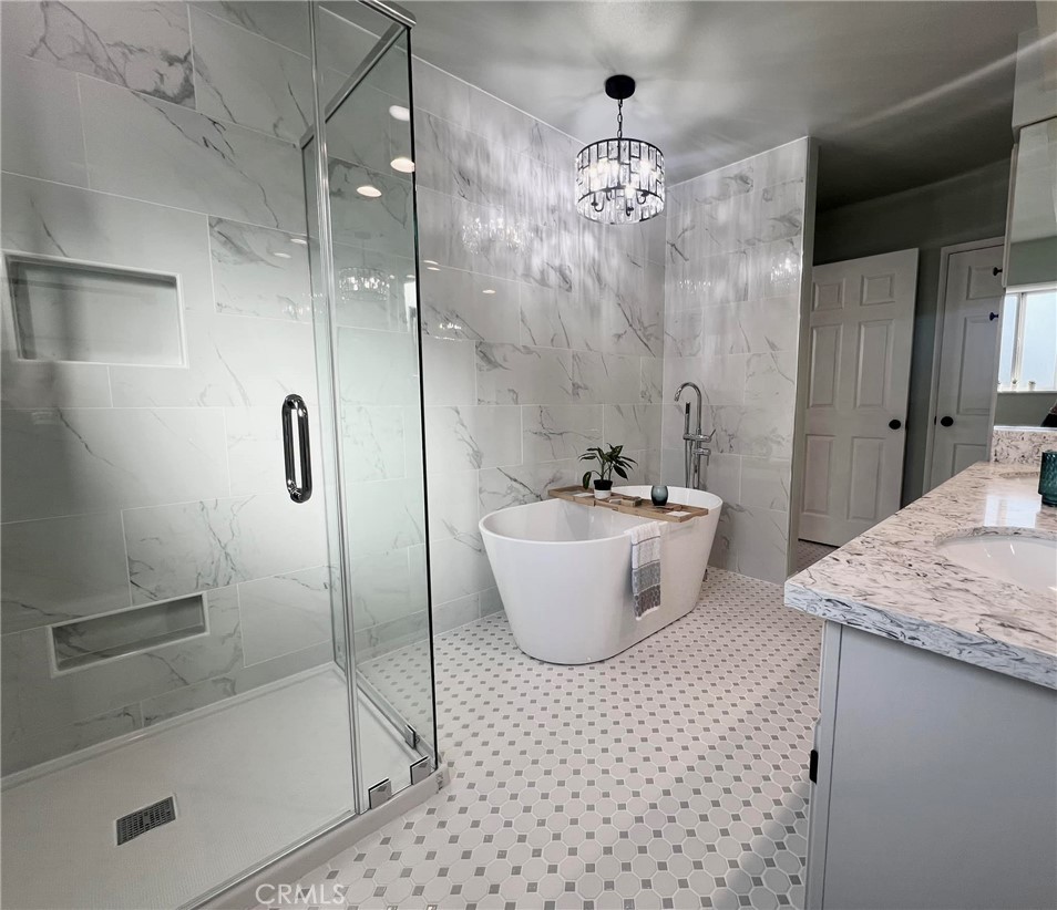 a bathroom with a bathtub and shower