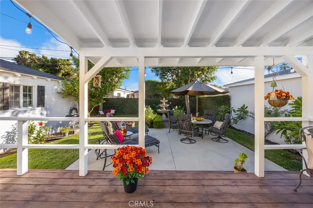 a outdoor living space with patio furniture and garden view