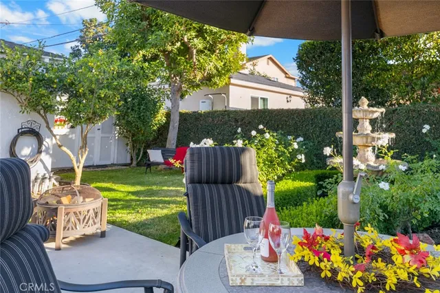 a view of a house with a fountain back yard and a fountain