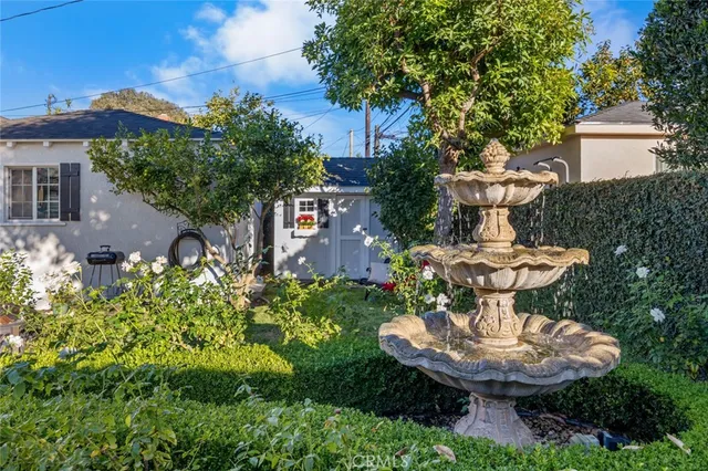 a view of backyard with outdoor seating and green space