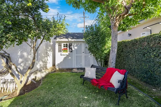 a view of house with swimming pool outdoor seating area