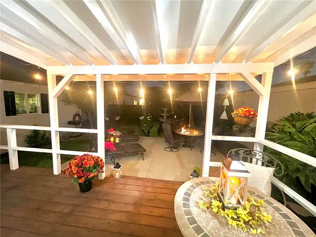 a living room with furniture and a mirror