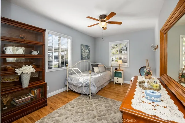 a bedroom with a bed that has a bed and a table in it