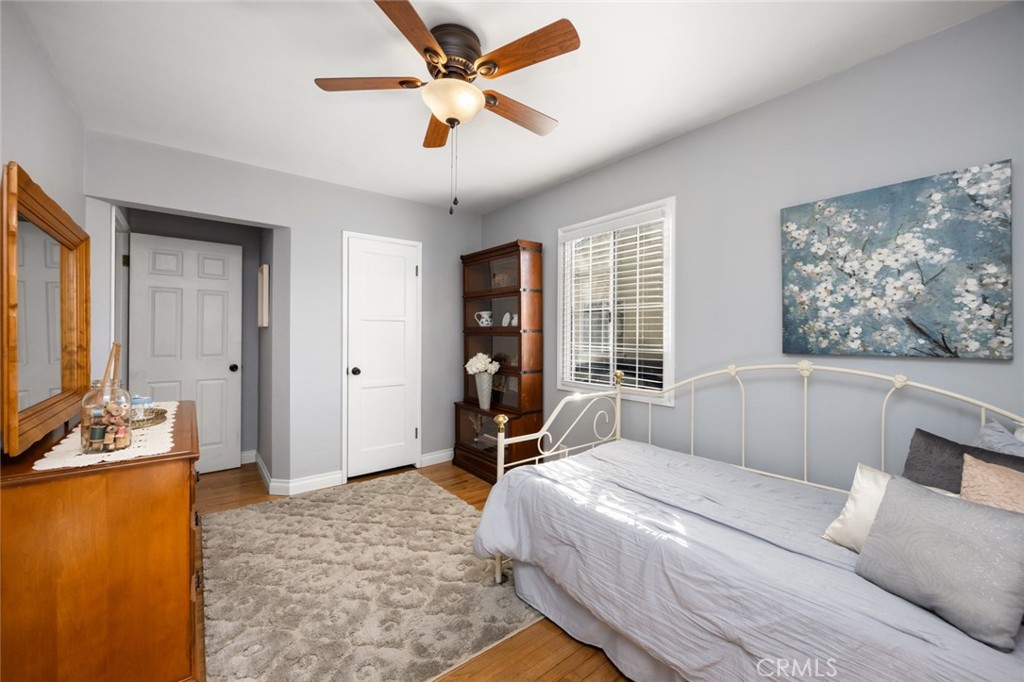 520 West 37th Street Long Beach, CA 90806 - Photo 29 of 50 a bedroom with a bed and a chandelier