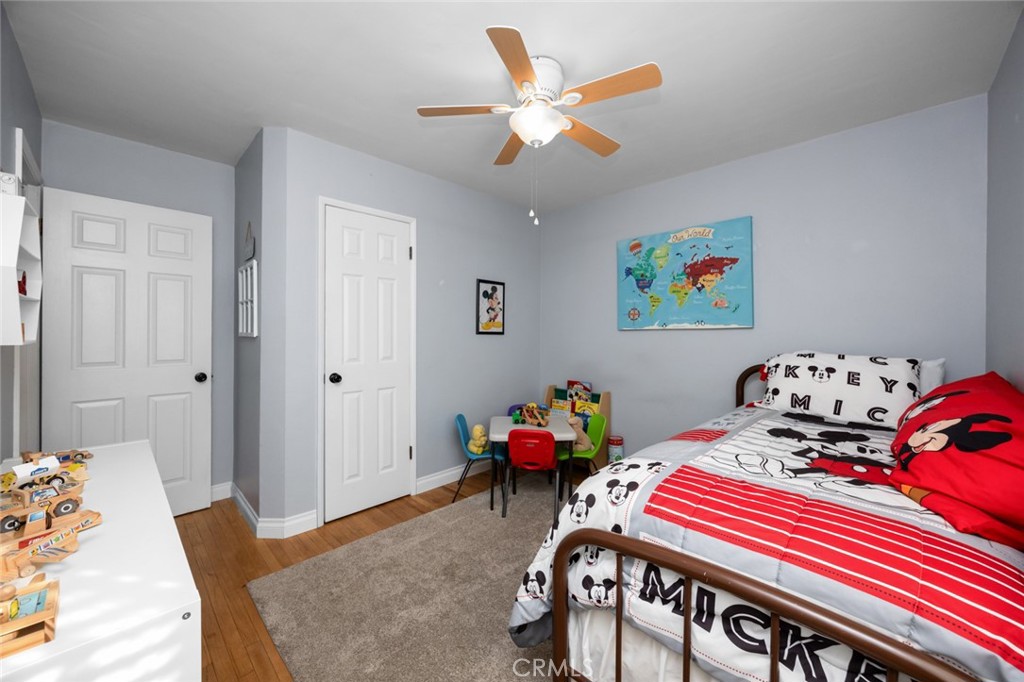 520 West 37th Street Long Beach, CA 90806 - Photo 30 of 50 a bedroom with a bed that has a bed and a table in it