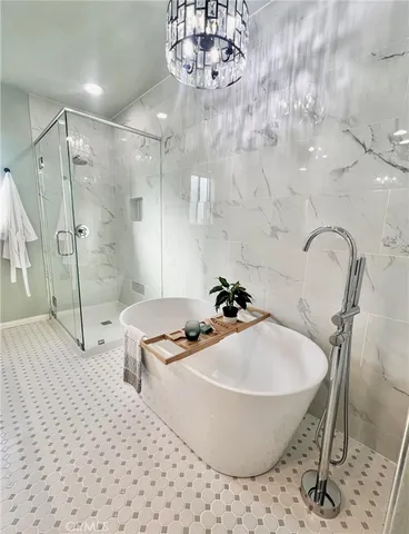 a bathroom with a sink a mirror and a shower
