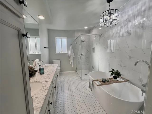 a bathroom with a tub sink and shower
