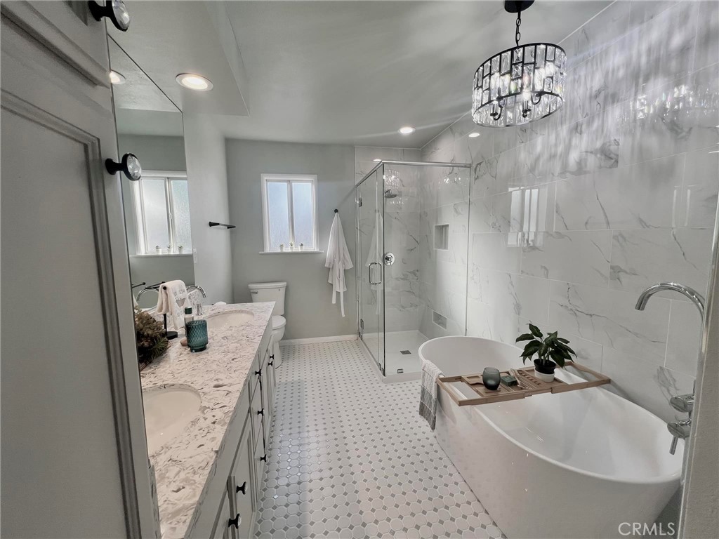 520 West 37th Street Long Beach, CA 90806 - Photo 4 of 50 a bathroom with a tub sink and shower