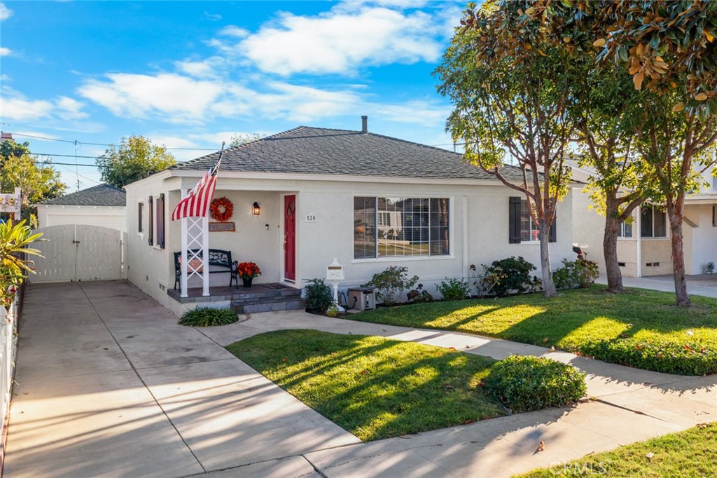 520 West 37th Street Long Beach, CA 90806 - Photo 41 of 50 a view of a white house with garden and yard