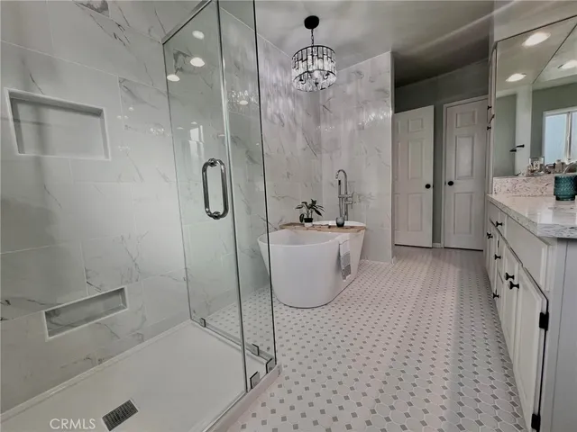 a spacious bathroom with a granite countertop sink a toilet and shower
