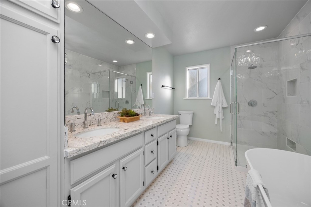 520 West 37th Street Long Beach, CA 90806 - Photo 6 of 50 a bathroom with a double vanity sink toilet mirror and bathtub