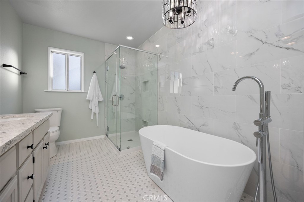 520 West 37th Street Long Beach, CA 90806 - Photo 8 of 50 a white bath tub sitting next to a white toilet