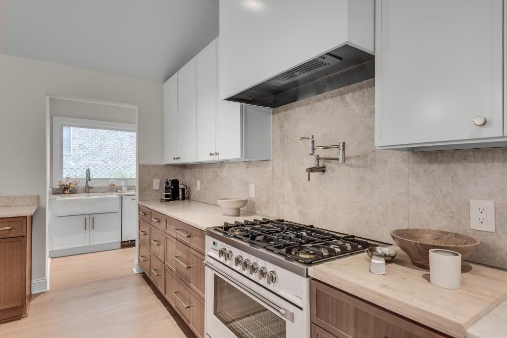 2362 Greenglade Road Northeast Atlanta, GA 30345 - Photo 21 of 39 a kitchen with a stove and a sink