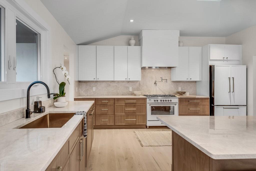 2362 Greenglade Road Northeast Atlanta, GA 30345 - Photo 22 of 39 a kitchen with kitchen island a sink a stove and refrigerator