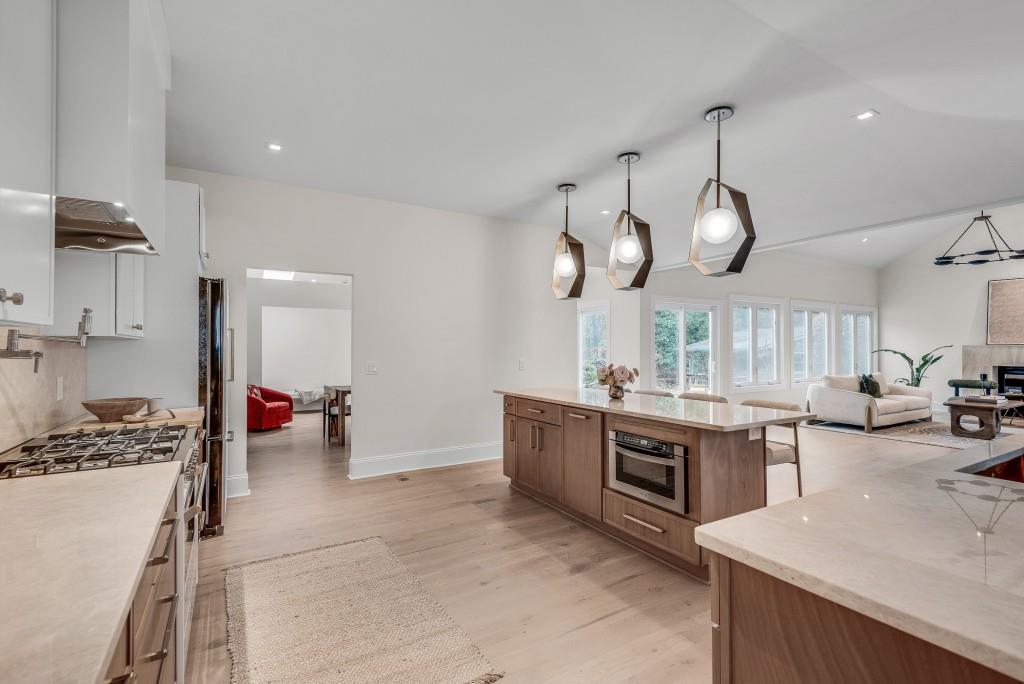 2362 Greenglade Road Northeast Atlanta, GA 30345 - Photo 23 of 39 a large kitchen with a lot of counter space and wooden floor