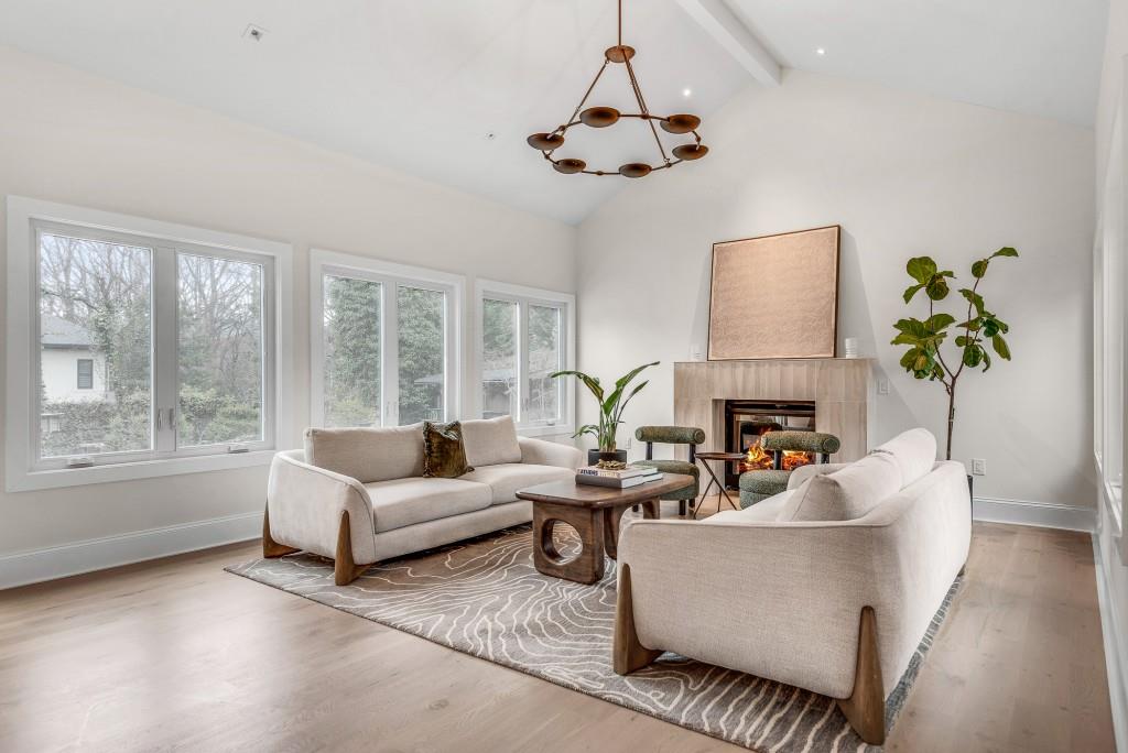 2362 Greenglade Road Northeast Atlanta, GA 30345 - Photo 28 of 39 a living room with furniture a bed and a chandelier