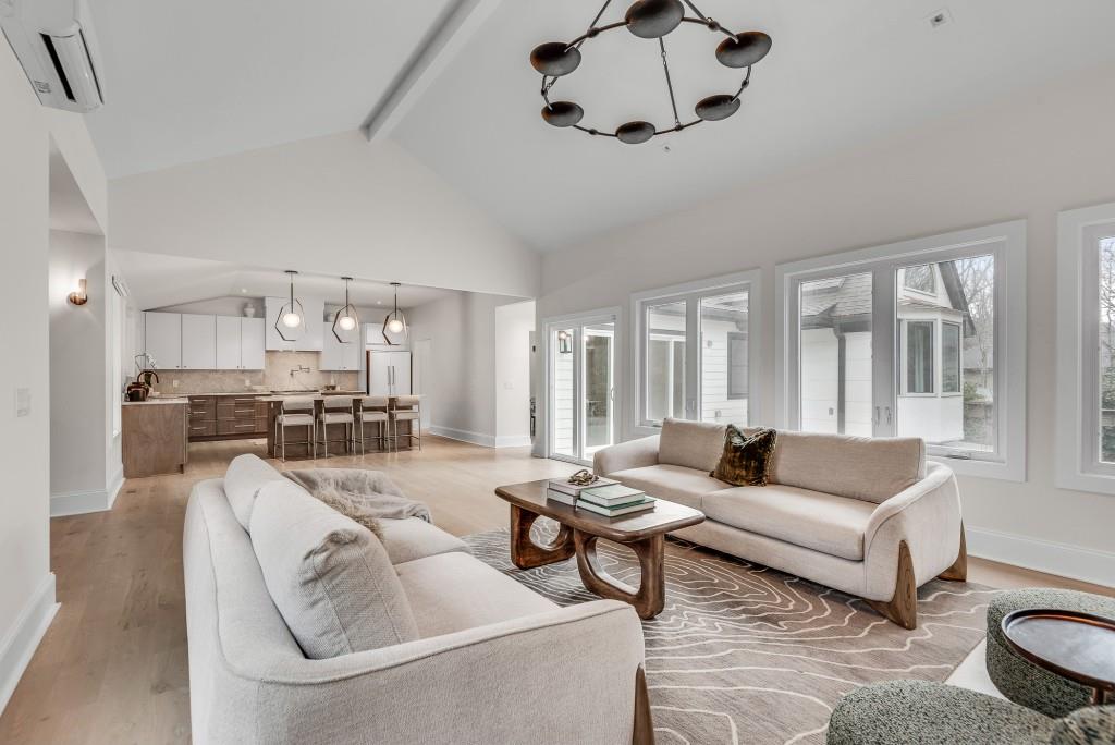 2362 Greenglade Road Northeast Atlanta, GA 30345 - Photo 29 of 39 a living room with furniture kitchen view and a large window