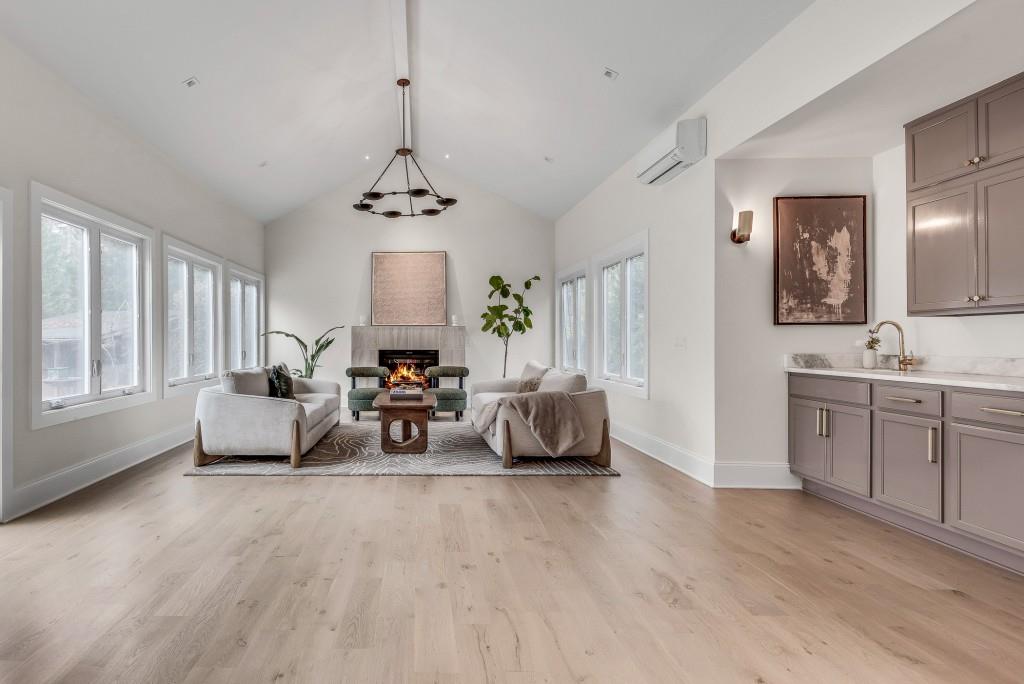 2362 Greenglade Road Northeast Atlanta, GA 30345 - Photo 32 of 39 a living room with furniture and a chandelier