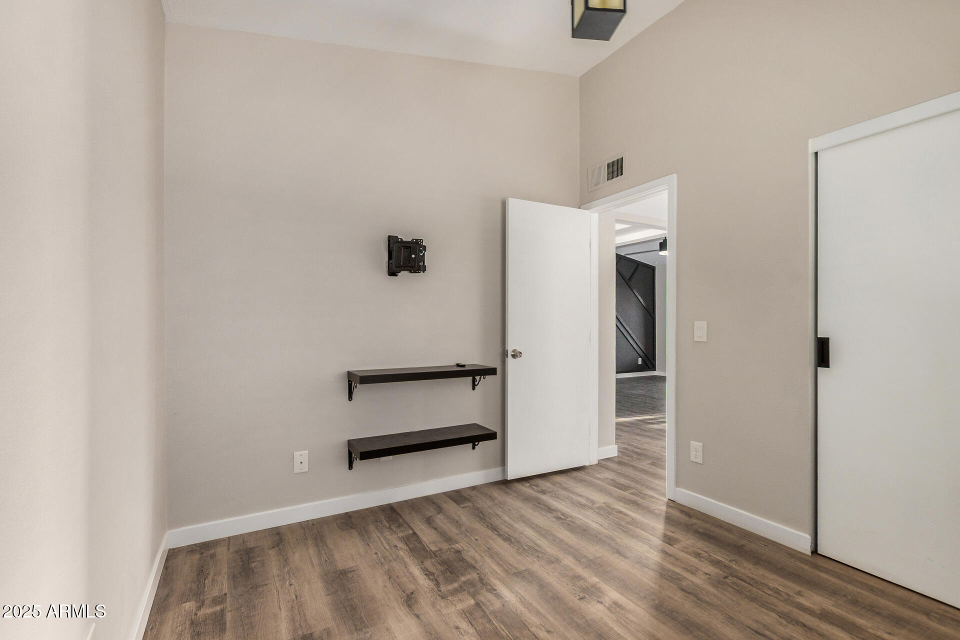 421 East Wickieup Lane Phoenix, AZ 85024 - Photo 12 of 24 a view of empty room with wooden floor