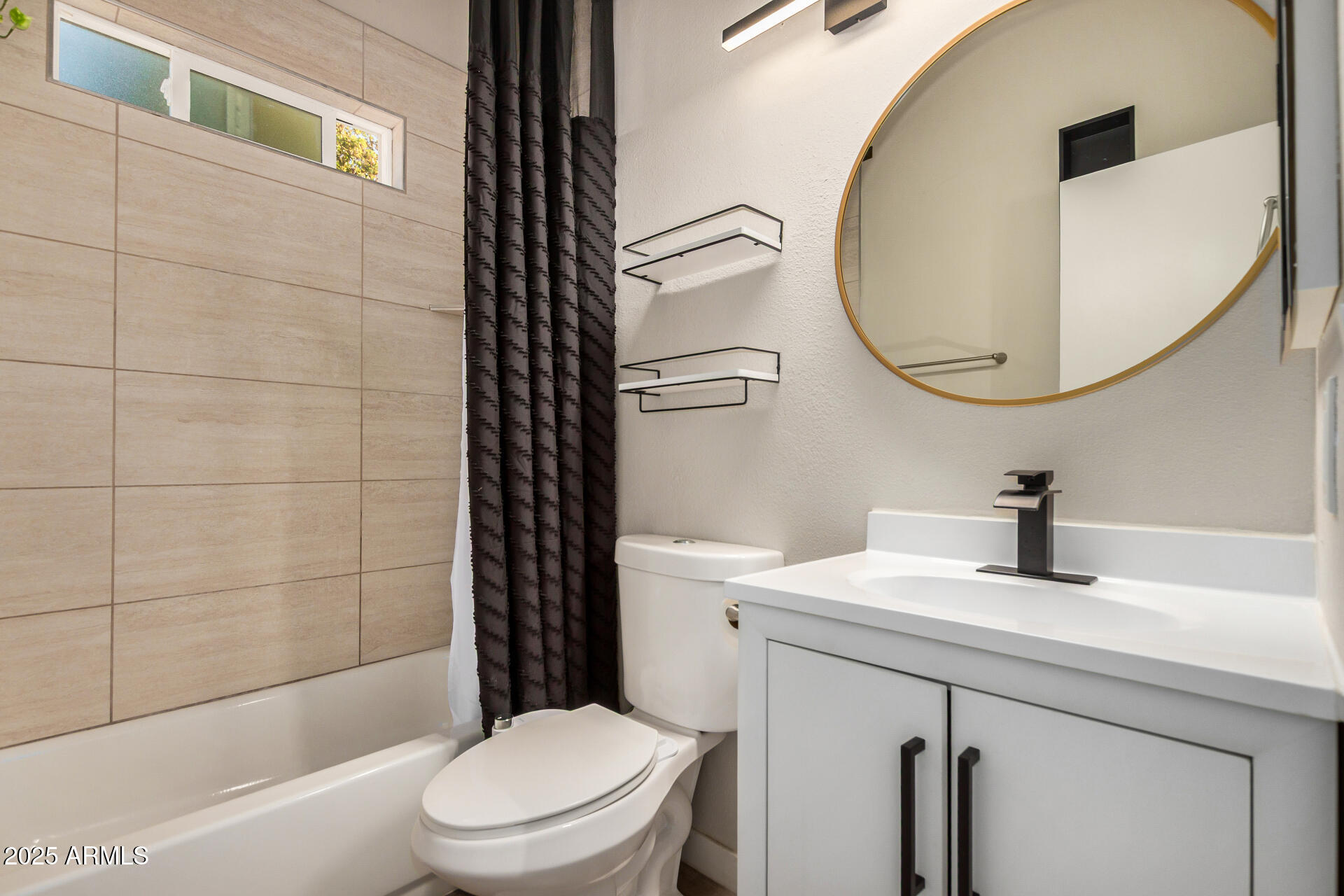 421 East Wickieup Lane Phoenix, AZ 85024 - Photo 15 of 24 a bathroom with a sink a toilet and a mirror