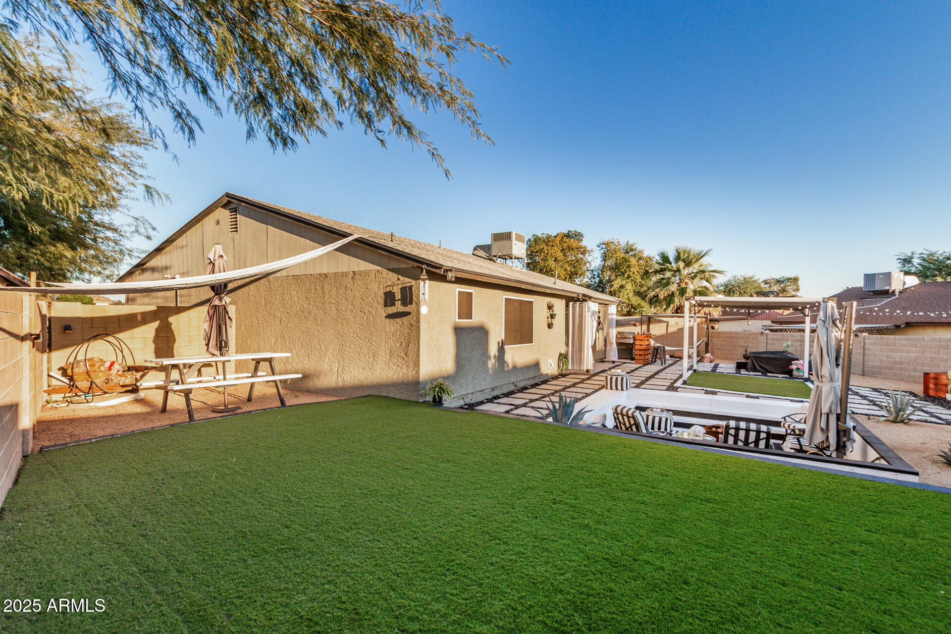421 East Wickieup Lane Phoenix, AZ 85024 - Photo 19 of 24 a view of a house with a yard and sitting area