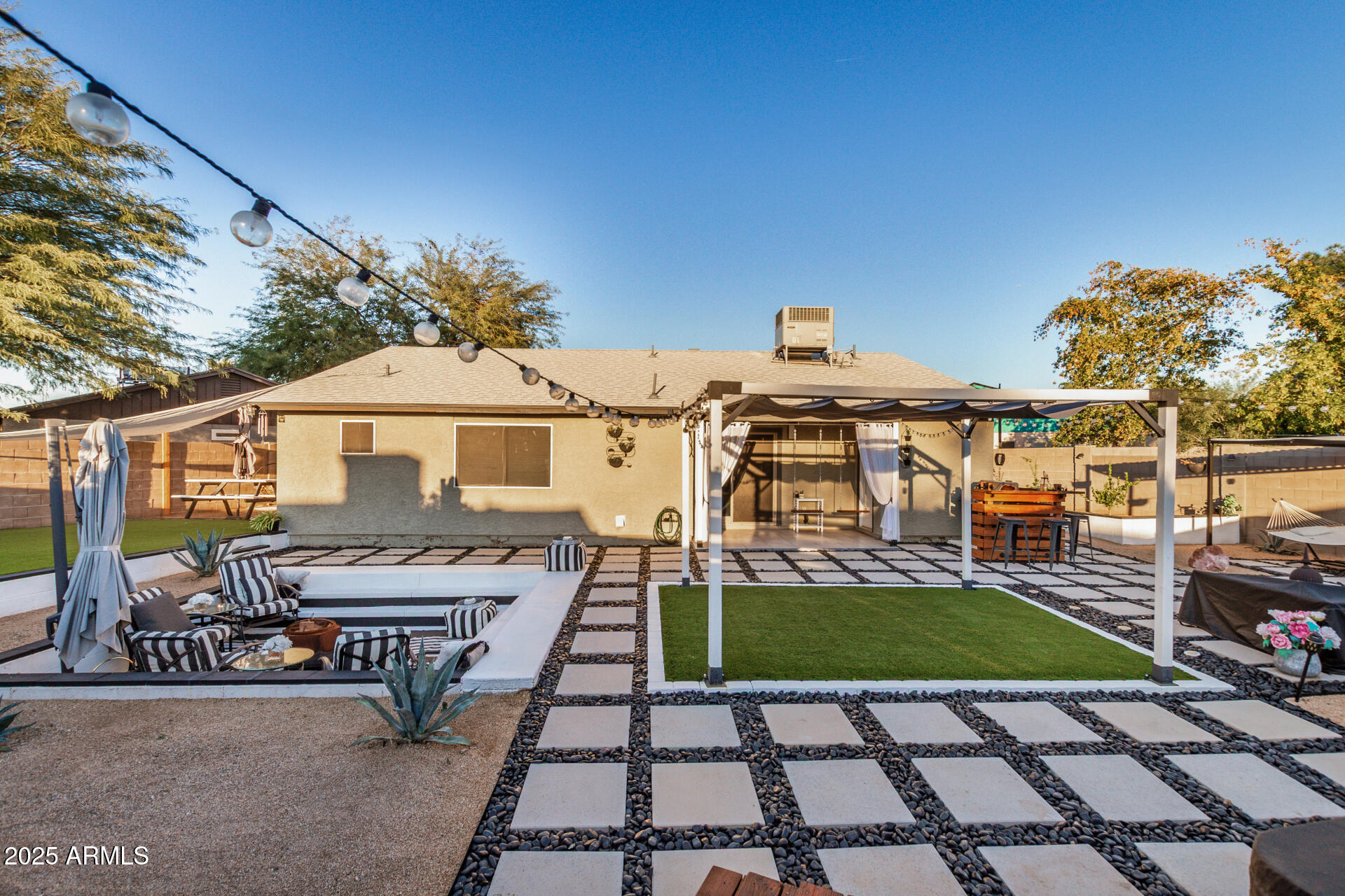 421 East Wickieup Lane Phoenix, AZ 85024 - Photo 20 of 24 a view of a patio with table and chairs with wooden floor and fence