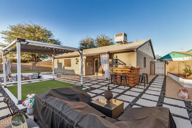 a view of a house with backyard porch and patio