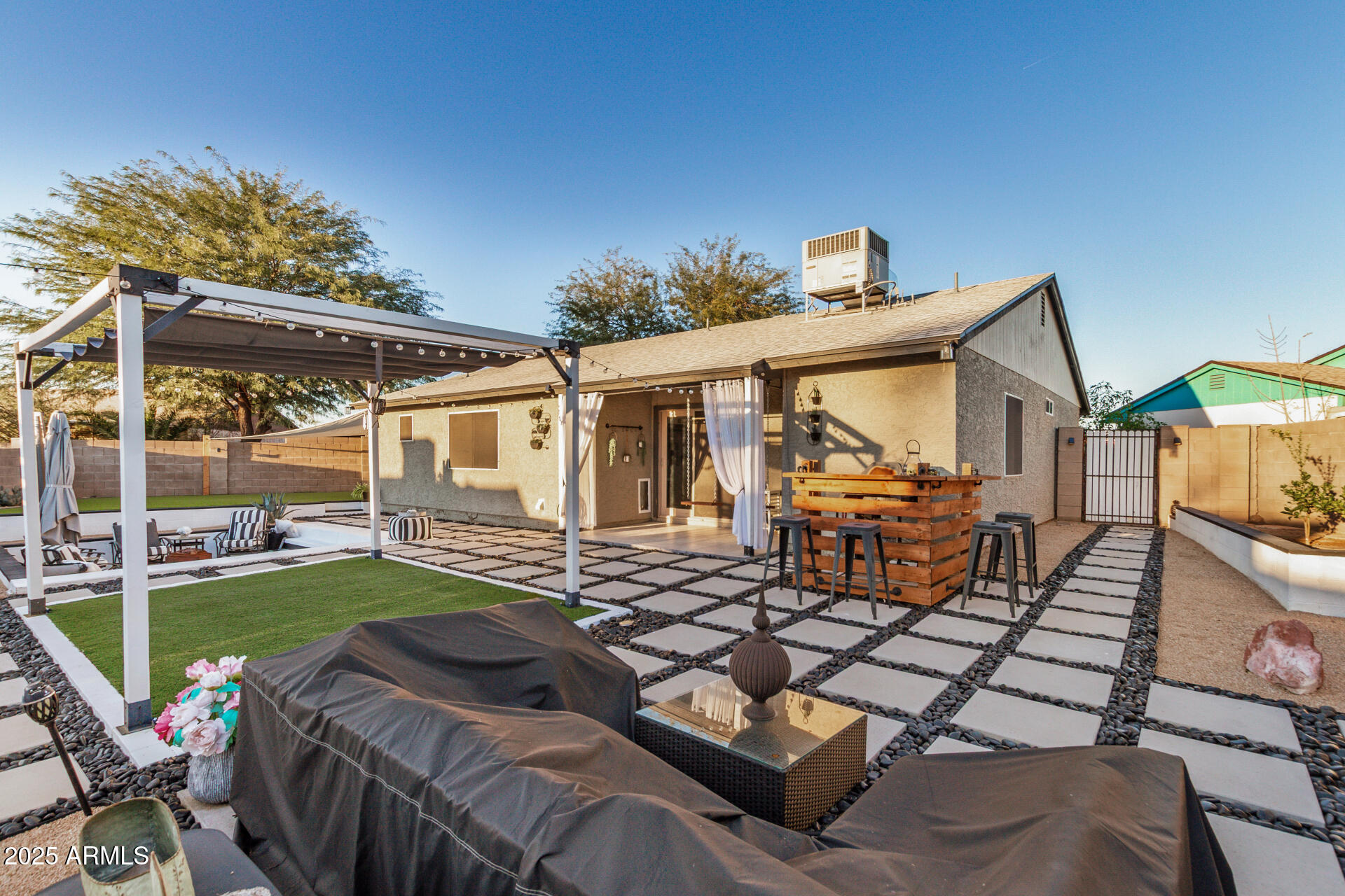 421 East Wickieup Lane Phoenix, AZ 85024 - Photo 21 of 24 a view of a house with backyard porch and patio