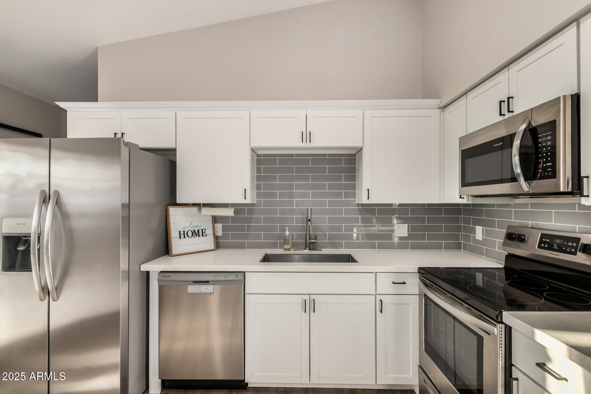 421 East Wickieup Lane Phoenix, AZ 85024 - Photo 6 of 24 a kitchen with stainless steel appliances cabinets a sink and a counter