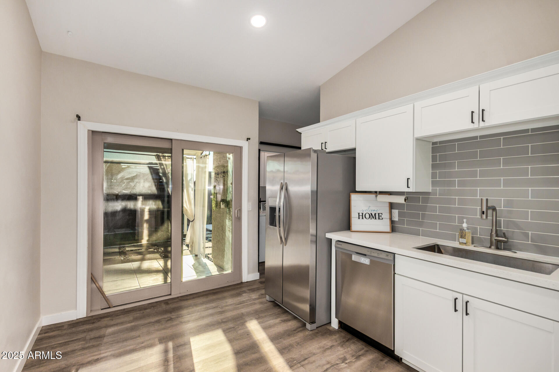 421 East Wickieup Lane Phoenix, AZ 85024 - Photo 7 of 24 a kitchen with stainless steel appliances granite countertop a refrigerator and a sink