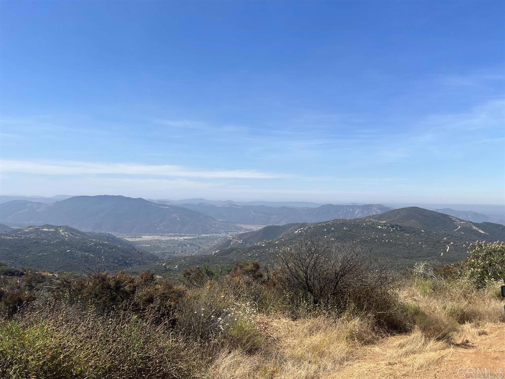0 Sunset Peak Road Pala, CA 92059 - Photo 3 of 11 a view of a mountain range with lush green forest