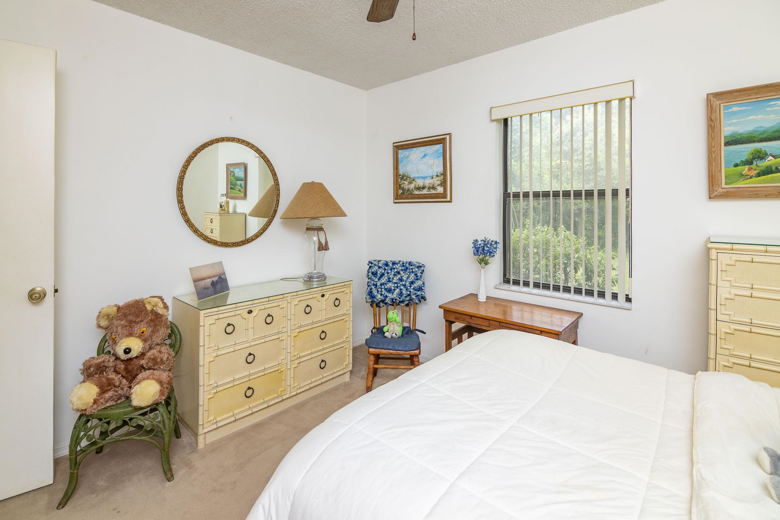 303 Cypress Road St. Augustine, FL 32086 - Photo 17 of 33 a bedroom with a bed and a dresser